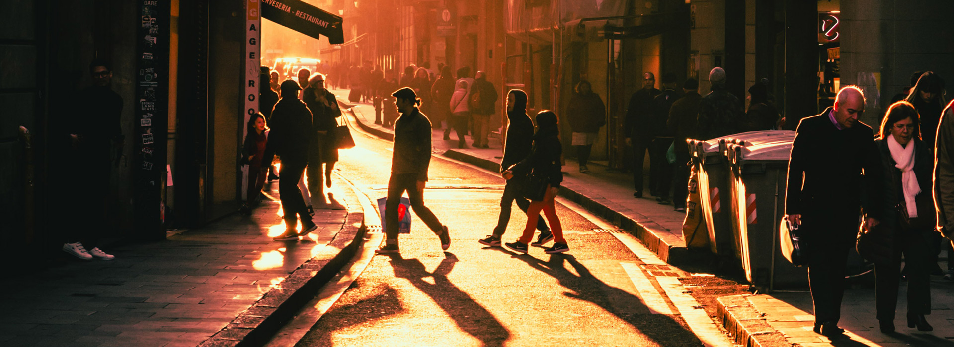 People walking in a crowded street day break dawn warm